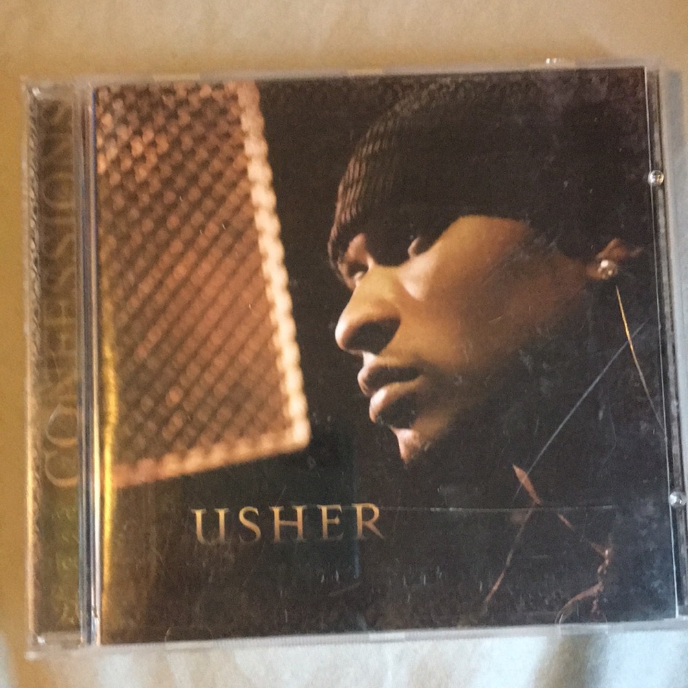 Usher cd album is confessions. Amazing condition.